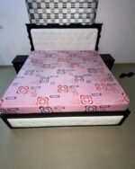 Neatly used 6by6 white bedframe with pink mattress and side stool