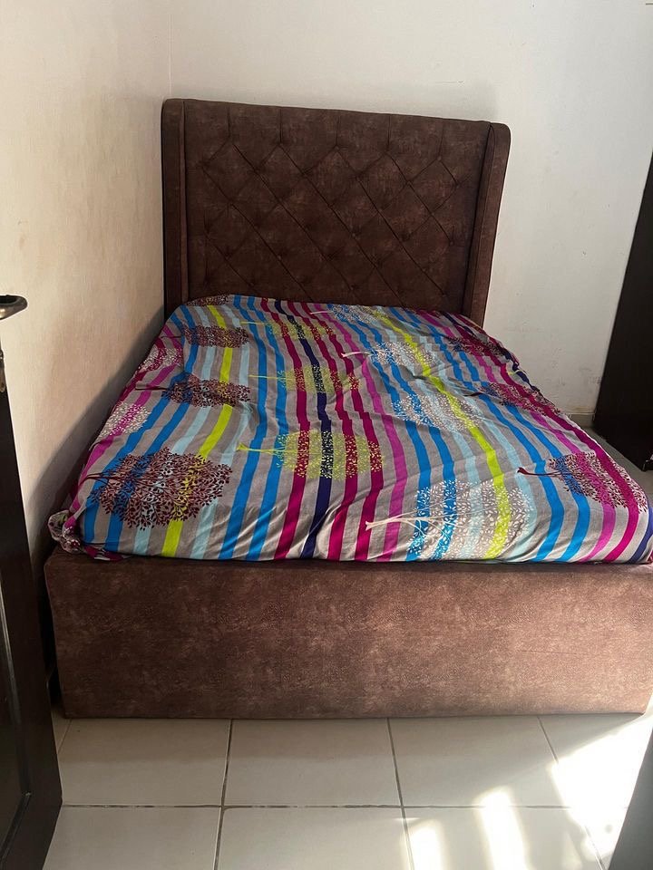 f0567506-07da-4136-bd93-a77a3ae11718 Neatly Used 4.5by6 bedframe with matress(matress slightly tun) - Image 1