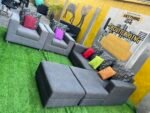 Neatly Used L Shape Sofa With 2 Single Seater, Ottoman And Throw Pillows