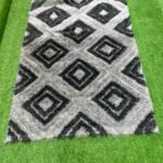 Barely Used 7by10 Black And Grey Shaggy Center Rug