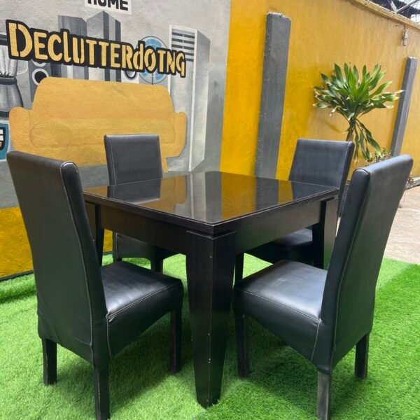 Neatly Used Glass Top Black 4 seater Dinning Set