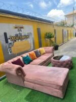 Neatly Used L Shape Peach Sofa With Center Piece And Pillows(Needs Washing)