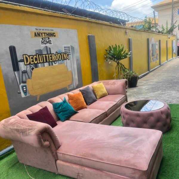 Neatly Used L Shape Peach Sofa With Center Piece And Pillows(Needs Washing)