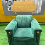 Neatly Used Single Seater Green Sofa With Gold Tape