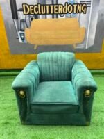 Neatly Used Single Seater Green Sofa With Gold Tape