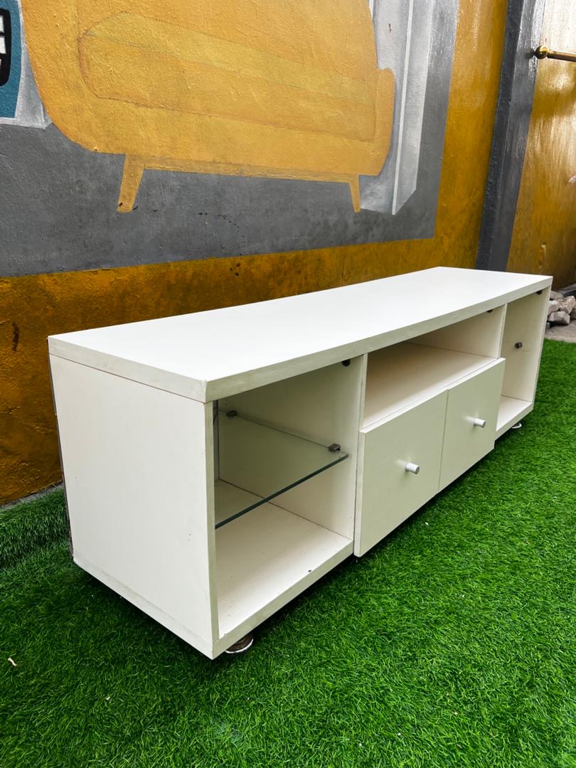 3fd36470-21e4-4251-b1fa-28a4a01e531a Barely Used 60inch Long , 20inch High White Tv Console With Glass Divider - Image 1