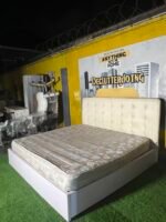 Neatly Used 6by6 White Leather & Wood Bedframe With Semi Orthopedic Mattress - Image 2