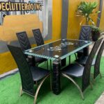 Neatly Used 6 Seater Glass Top Black Dinning Set ( the iron part of the chairs are rusted)