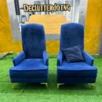 Neatly Used Blue Accent Armless Chair With Pillows