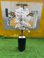 Relatively New White & Green Artificial Flower With Black Plastic Vase - Image 4