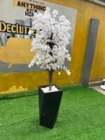 Relatively New White & Green Artificial Flower With Black Plastic Vase
