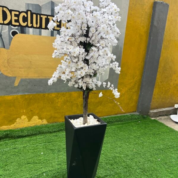 Relatively New White & Green Artificial Flower With Black Plastic Vase
